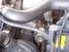 1997 Mitsubishi Eclipse - Close-up view of an engine bay, showing various components and hoses, with a date stamp indicating it was taken in 2005.