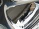1999 Mitsubishi 3000GT - Corrosion and pitting are visible on the inner barrel of this chrome wheel rim.