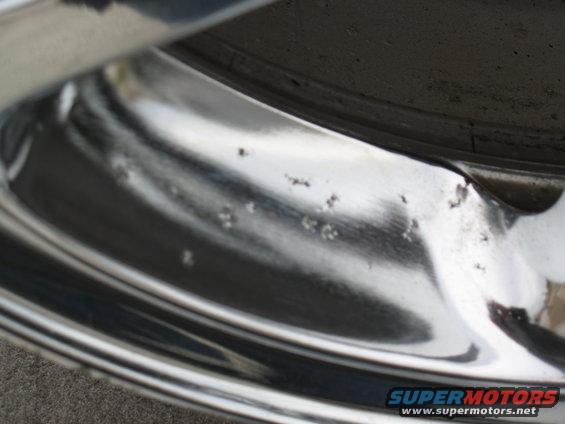 Surface pitting, present on all rims. This is the first stage of failure of the chrome.