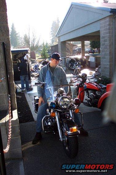 2005 Harley-Davidson FLH motorcycle with blue lights and a windshield