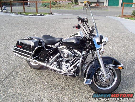 Black 2005 Harley-Davidson FLH parked on asphalt