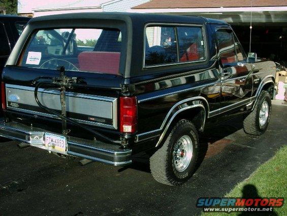 Black 1984 Ford Bronco rear view with spare tire carrier