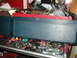 1979 Ford Bronco - A toolbox is open, revealing a collection of tools and supplies within its compartments.