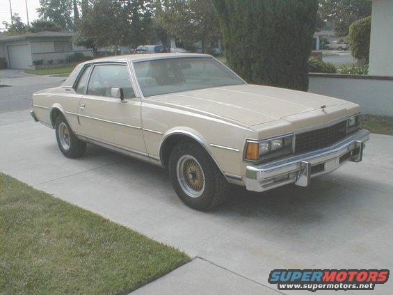 Tan 1977 Chevrolet Caprice coupe parked on a driveway, front 3/4 view