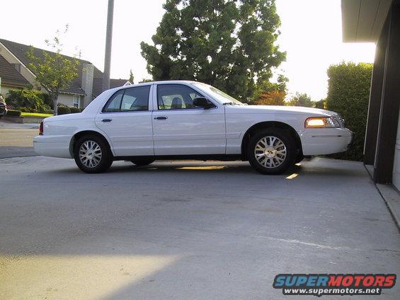 2003 Ford Crown Victoria parked on concrete driveway, side view
