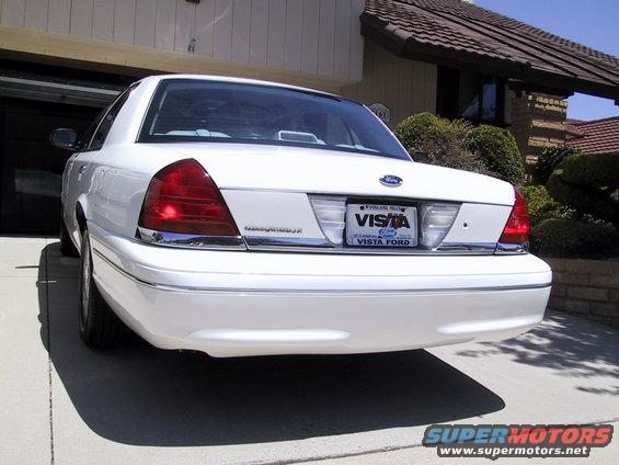 White 2003 Ford Crown Victoria rear view, parked in driveway
