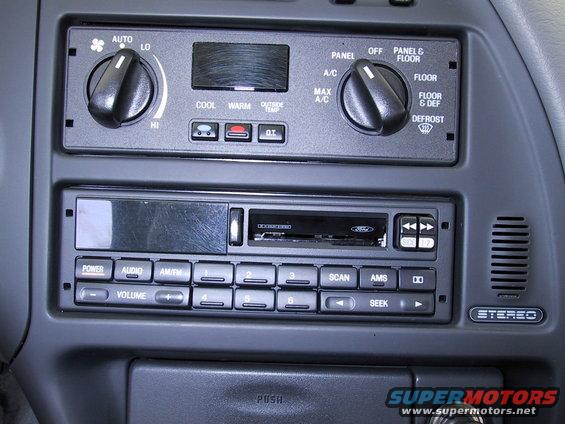 Interior view of car dashboard climate controls and Ford stereo