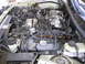 1997 Ford Thunderbird - The engine bay is shown, with a "4.6L DOHC" marking visible on the intake manifold.