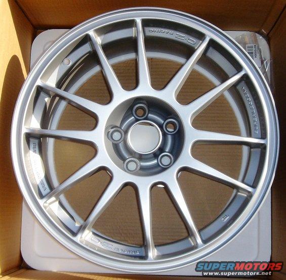 OZ Racing wheel in a box. Text on wheel reads "OZ RACING" and "SUPERLEGGERA"