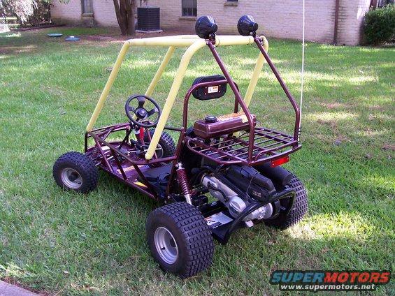 Purple go-kart with yellow roll cage and black tires, viewed from the rear
