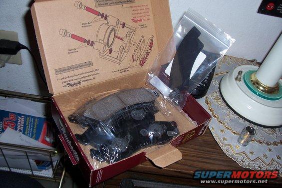 Box of Raybestos brake pads with installation diagram on the inside lid