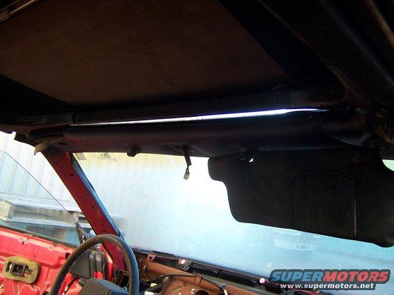 Interior view of a 1984 Toyota Celica showing the headliner, sun visor, and dashboard area