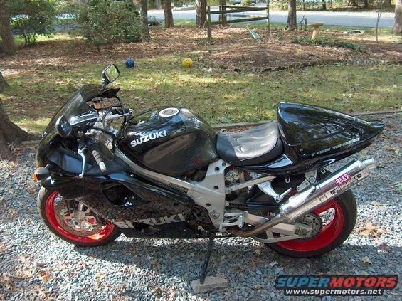 Black Suzuki motorcycle with red wheels and Yoshimura exhaust