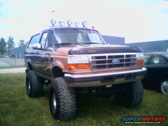 1995 Ford Bronco Eddie Bauer, 3q-front view, lifted with flame decals