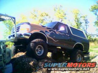 Lifted 1995 Ford Bronco with flame decals, 3q-front view