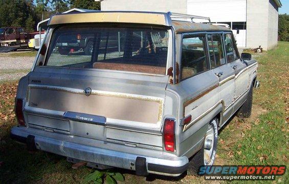 Silver 1985 Jeep Grand Wagoneer, rear view