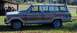 1985 Jeep Grand Wagoneer - Side view of a 1985 Jeep Grand Wagoneer with wood grain trim.