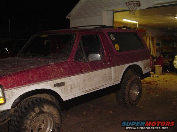 1994 Ford Bronco, red and white two-tone paint, lifted suspension, off-road tires
