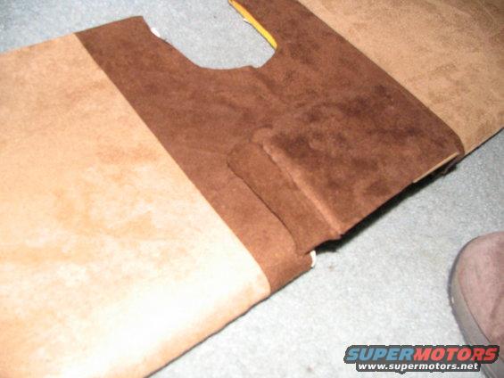 Tan and brown car interior upholstery with a cut-out section