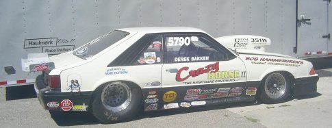 White 1982 Ford Mustang drag car with 'Crazy Horse II' decal and racing sponsors
