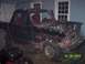 1994 Ford Bronco - This heavily damaged black Ford Bronco shows significant front-end destruction and a red interior.