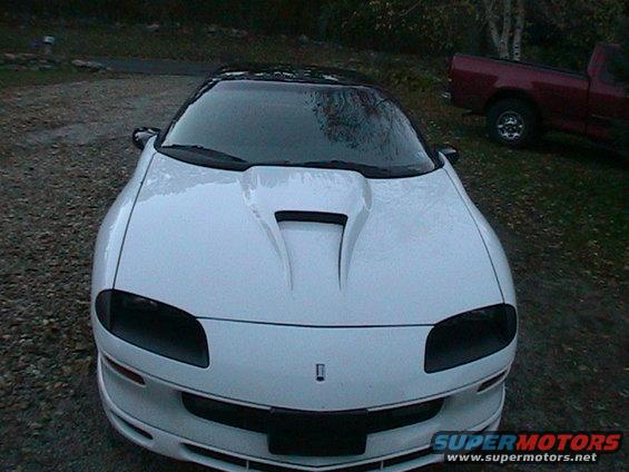 White 1996 Chevrolet Camaro front view with black roof, aftermarket hood scoop, and tinted headlights
