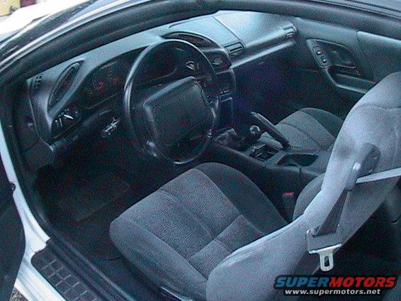 Interior of a 1996 Chevrolet Camaro showing dashboard, steering wheel, and seats