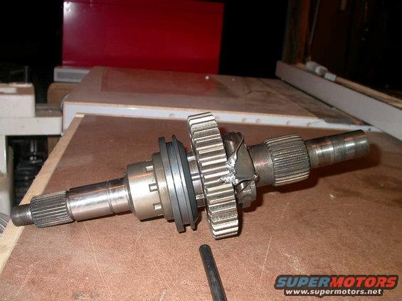 dscn2732.jpg Oil pump retainer bracket bent into drive sprocket, caused by oil pump siezing to output shaft