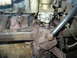 1973 Jeep CJ5 - Engine components including a carburetor and exhaust manifold are shown in this close-up view.