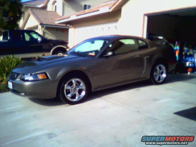 Dark gray 2002 Ford Mustang parked in a driveway