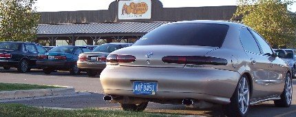 1998 Mercury Sable rear view, parked in a lot with other cars