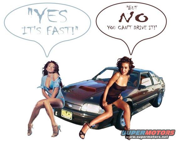 Two women sit on the hood of a dark-colored car