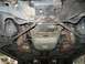 1999 Ford Crown Victoria - Underside of a 1999 Ford Crown Victoria, detailing the exhaust and drivetrain components.