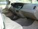 1999 Ford Crown Victoria - The interior of a 1999 Ford Crown Victoria is shown, a tan interior and dashboard details.