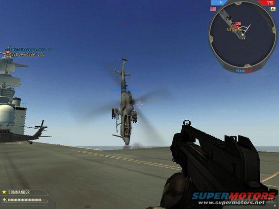 Helicopters on an aircraft carrier deck, with a gun in the foreground