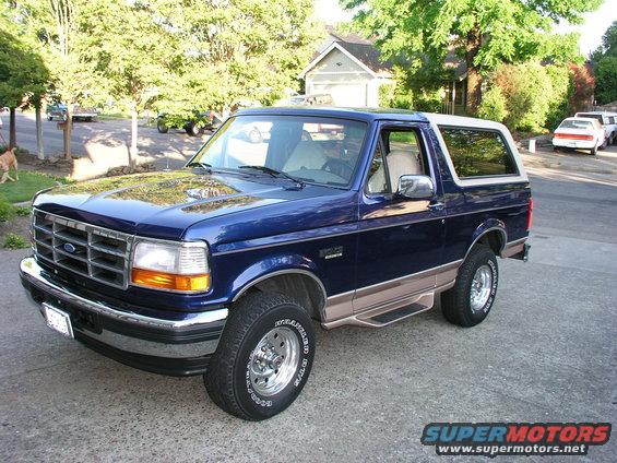 Blue 1996 Ford Bronco parked on a residential street