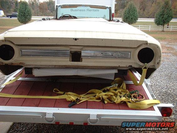 1964 Ford Galaxie convertible body, tan, on a trailer, rear view, missing headlights and grille insert
