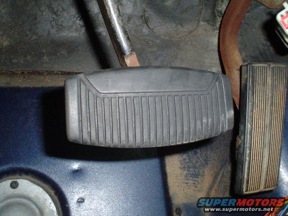 close-up of brake and gas pedals inside a vehicle