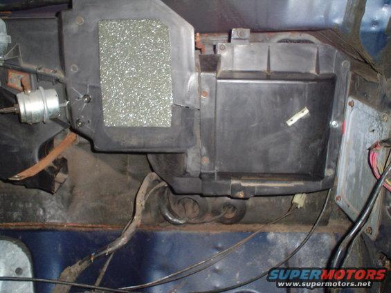 HVAC heater core box and ducting with wiring and insulation visible
