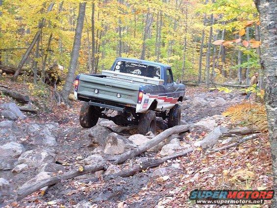 1977 Ford F-150 rear view off-roading on rocky trail