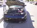 1993 Ford Probe - Front view of a 1993 Ford Probe with its hood open, revealing the engine compartment.