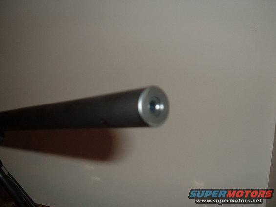 Close-up of a metal rod with a threaded end, possibly a part