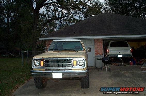 1978 Dodge Power Ram pickup truck front end, parked in driveway. Another vehicle is in the garage behind it