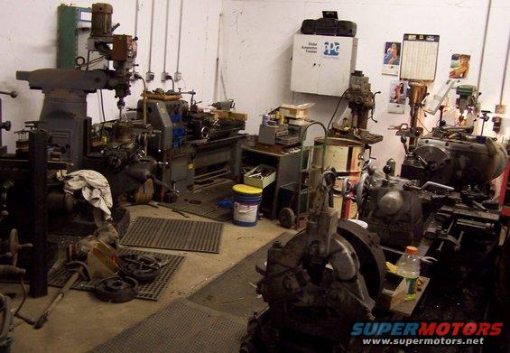 Workshop interior with milling machines, lathes, and other industrial equipment