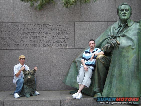 Statue of FDR with two men and a dog sculpture