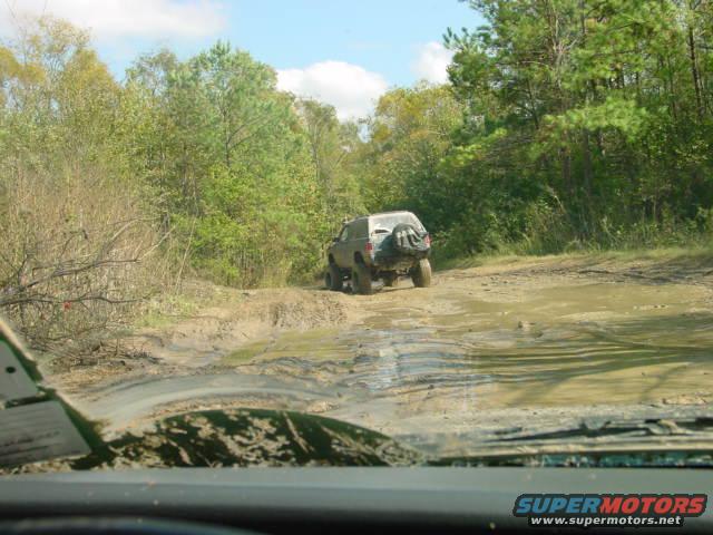 1992 Chevrolet S10 driving on muddy off-road trail
