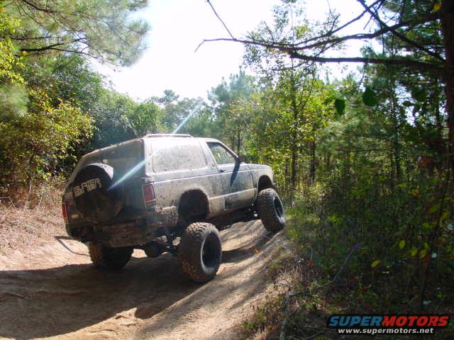 1992 Chevrolet S10 Blazer off-roading on a dirt trail, rear view