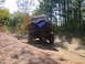 1992 Chevrolet S10 - Man clings to the rear door of a 1992 Chevrolet S10 Blazer as it navigates an off-road trail.