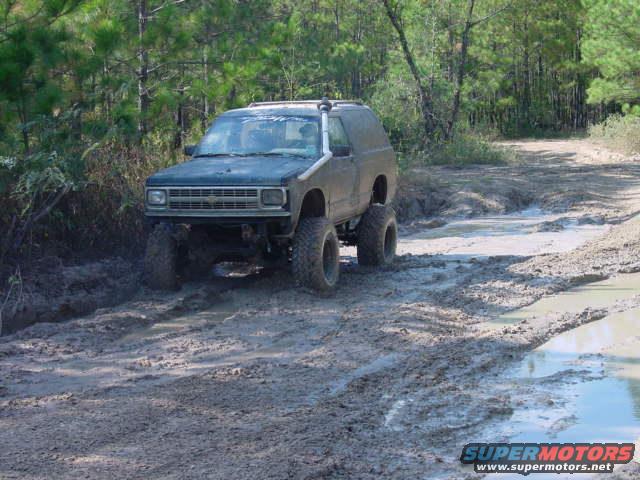 1992 Chevrolet S10 Blazer driving through mud on a trail