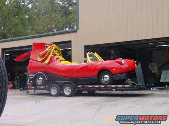 Red shoe car on trailer